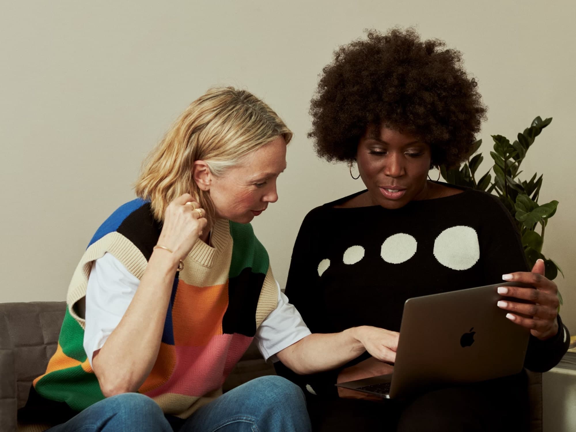 Two colleagues working through a plan together